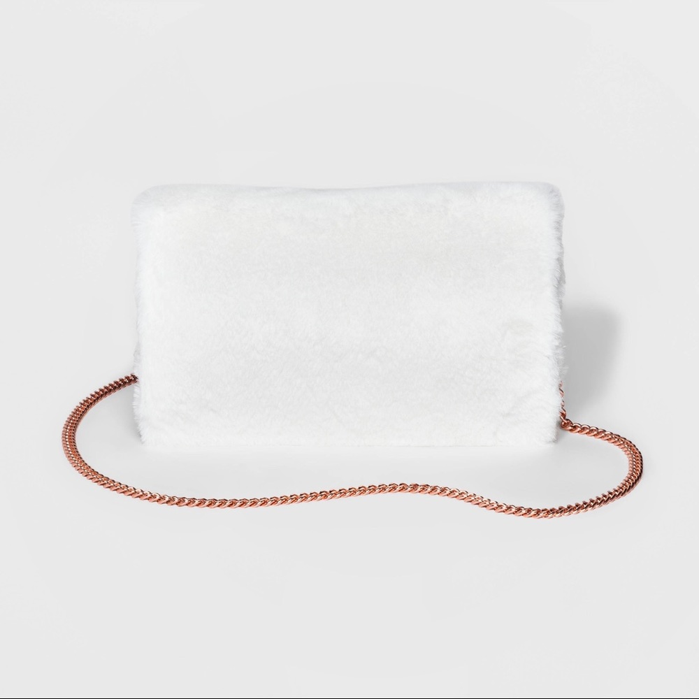 White Faux Fur clutch. With Shoulder chain NWOT